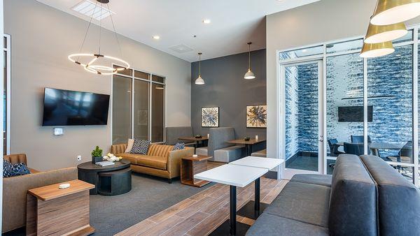 A modern living room with a flat screen TV mounted on the wall