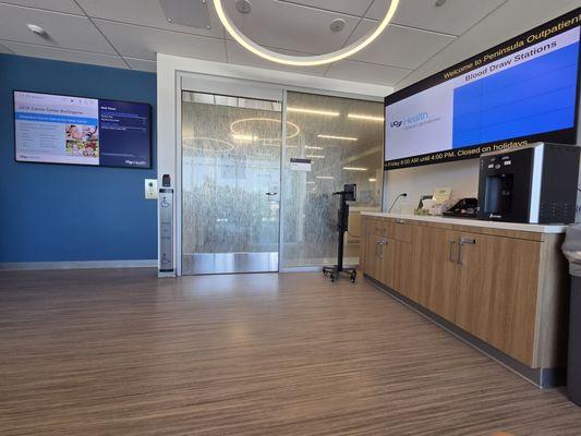 waiting area has coffee/tea station (to the right)