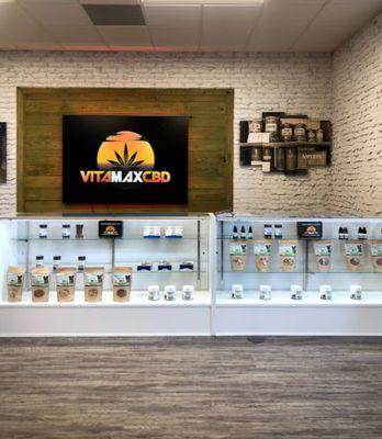 VitaMax "CBD, CBG, Delta-8 Product Center" ℠ product case and CBD, CGB, Delta-8 information station.