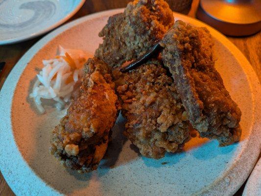 Mala wings - crunchy and spicy. Get it with a side of homemade hot chili oil for extra fire