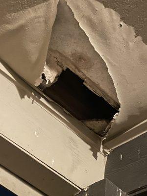 Patio ceiling where debris has fallen and is literally a hazard. Told by maintenance this is a common problem. "Contractor issue".