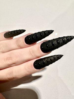 Fierce Stiletto. Builder gel over matte black to create a wet textural effect.