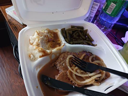 Hamburger steak grilled onions green beans and mashed potatoes