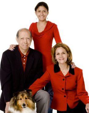 Christine Pacheco  with  her husband, daughter, and dog.