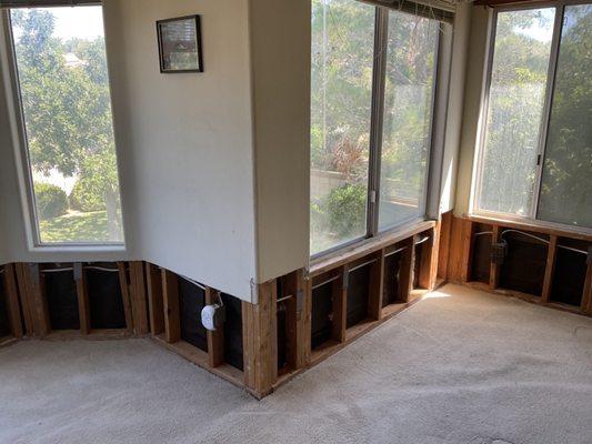 Bedroom with damaged drywall removed.