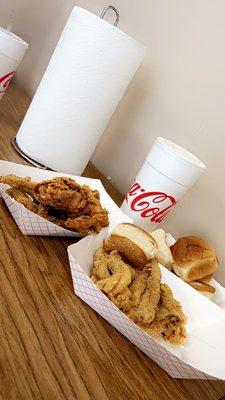 Fried chicken, cat fish, chicken tenders, and rolls