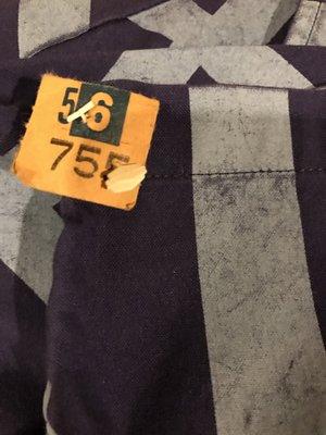 Burned fabric conveniently located next to their dry cleaning tag