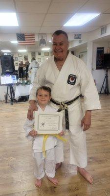 This is my son moving from white belt to yellow belt.