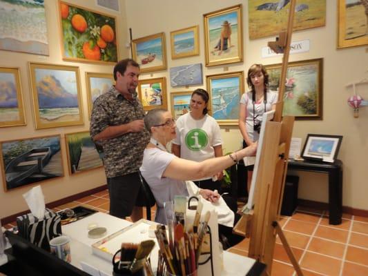 Lee Horton, our school's art teacher, introduces Maddie and Alex to Inez Hudson, a fellow artist with Lee at the Esplanade.