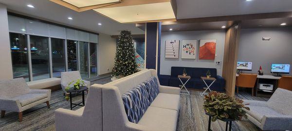 View of lobby from front desk. Christmas tree up for the holiday season