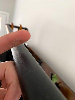 Dust on the top of hall tree in entry way