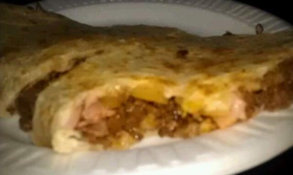 This is a Gringa, a quesadilla with ham, pineapple & pastor. Absolutely fantastic!