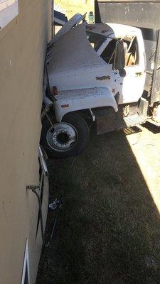 A dump truck ran into our house.