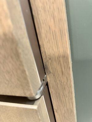 The staining is off along the fridge