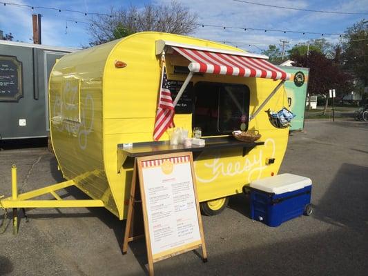 Their adorable yellow trailer!