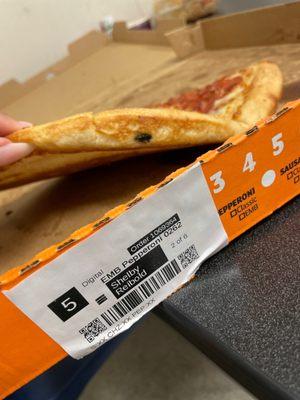 A fly is baked in our pizza... how does nobody check something like this!