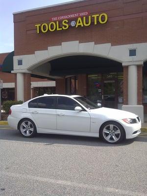 Happy customer in front of The Consignment Shed!