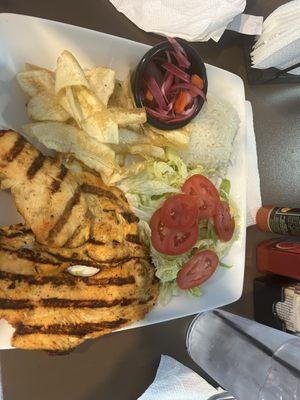 Grilled chicken with plantain chips salad, pickled onions, rice, beans, Honduran cream and pico de gallo! delicious combo and so fresh