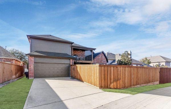 Back of home with new garage