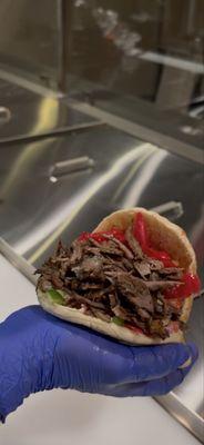 Beef shawarma pita with unlimited toppings