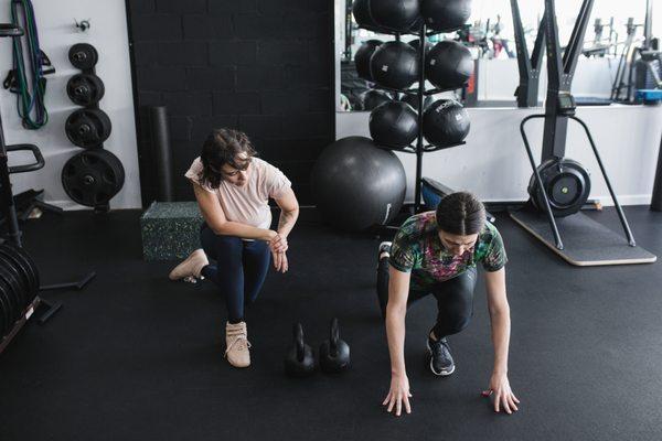 Checking ankle mobility for the squat.