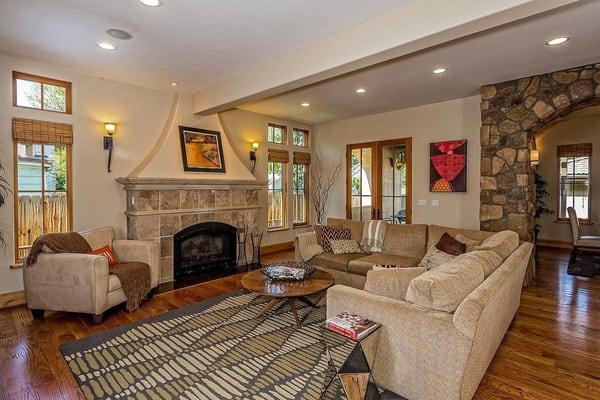 Custom fireplace and French doors to a private patio