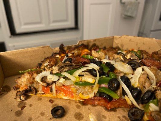 Pizza not cooked all the way in the center. Worst pizza ever.