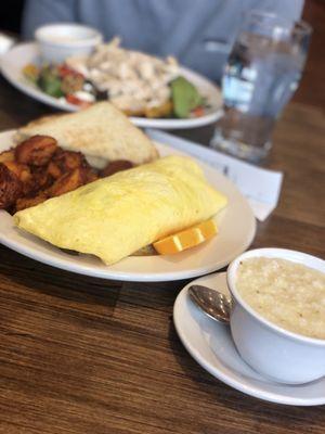 Avocado and bacon omelette with a side of grits