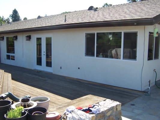 Outside kitchen with new windows and double french doors.
