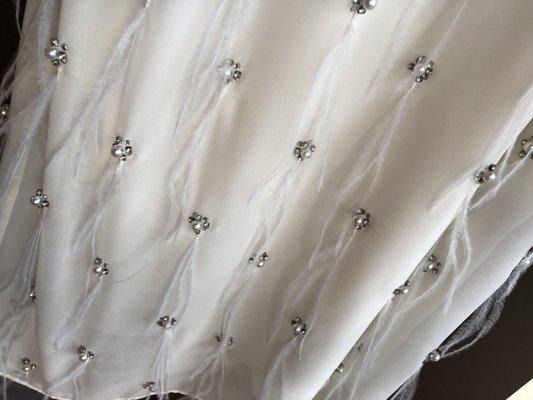 I mean I don't know how but they cleaned all spots and all my feathers and rhinestones are there! Beautiful job!