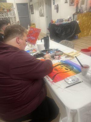 "Guests enjoying a creative painting session at our wellness center."