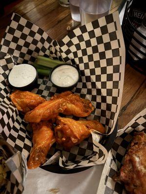 Buffalo wings served with blue cheese dressing & some celery sticks...5 wings per order.