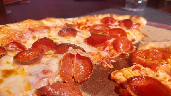 This is a pepperoni and extra cheese and it's the best peice of pizza I've had in years. Try this place. It's worth it.