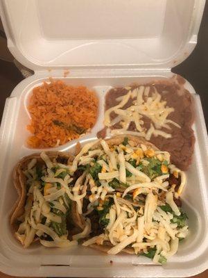 Chorizo taco dinner with cilantro, cheese and guacamole