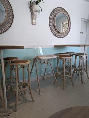 High tables with stools.
Store supplied highchair.