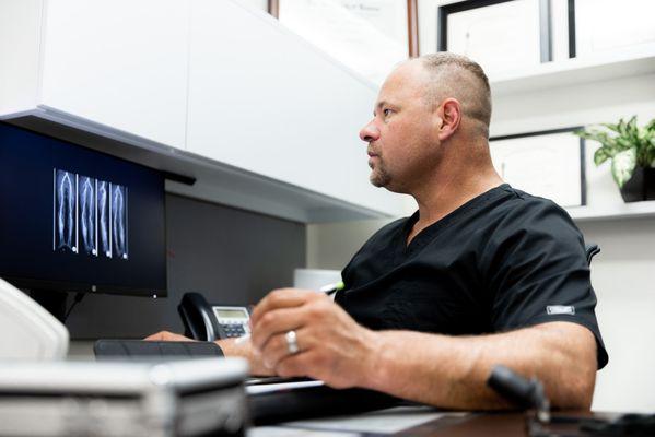 Dr. Stout reviewing patient charts
