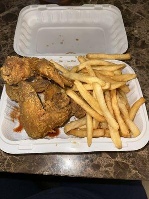 Chicken wings and fries