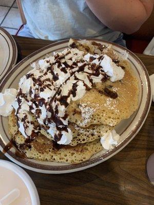 Chocolate chip homestyle pancakes with whipped cream for the teenager.