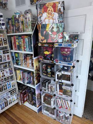 Shelf of assorted books and toys that they have in stock.
