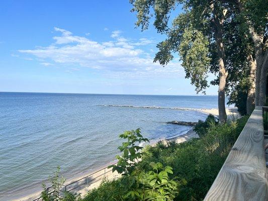 Rocking chairs invite visitors to sit by the light house and overlook the lake