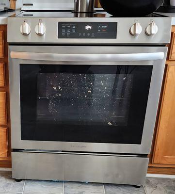 Stain on inner glass of stove.