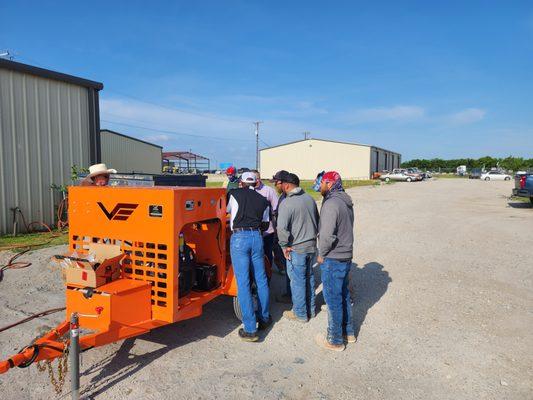 Explaining how their new pump operates. So, they have a good understanding before they go to the jobsite.