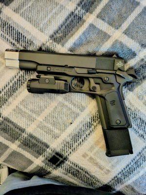 Rock Island Armory 1911-A1 FS .45 ACP with a stainless steel compensator. It has a capacity of 8 rounds, but I also purchased the ext. 10rd.