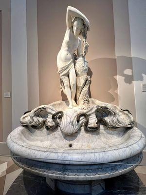 A nymph with snakes at her feet sculpture, I saw while waiting in line to get to the elevator to the Cantor Roof Garden Bar