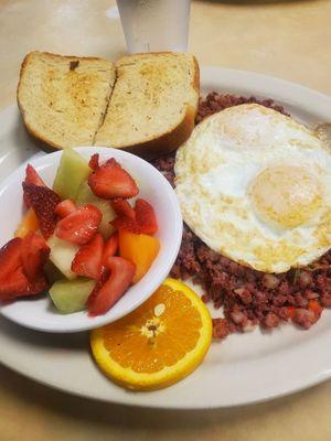 Homemade corned beef with fruit and toast