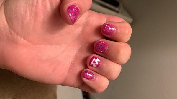 Sparkly pink nails with logo hand painted