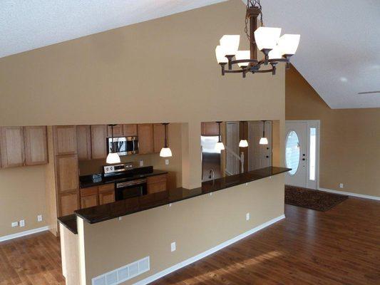 Part of a whole house remodel. we removed a wall to open up the dark small kitchen, added a granite island and hard wood flooring