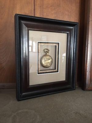 A pocket watch that belonged to my father beautifully prepared for display in my home by Frameworks.