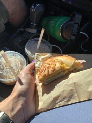 Coffees and Parmesan breakfast bagel.