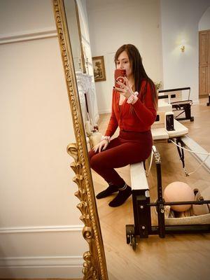 The beautiful mirrors and lovely white reformers.